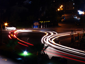 a freeway on-ramp at night.